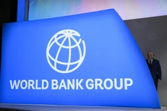 A stage director looks on at the IMF/World Bank Annual Fall Meetings Plenary Session in Washington, DC, on October 18, 2019. (Photo: AFP)